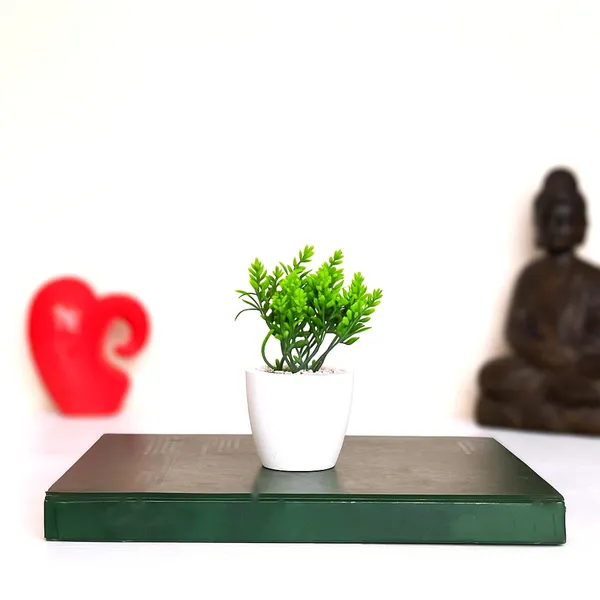 Elegant_Artificial_Green_Plant_Arrangement_in_a_White_Finish_Pot_with_Decorative_Pebbles