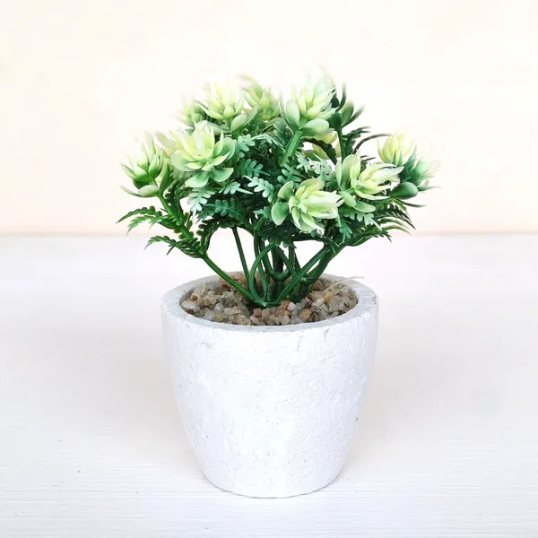 Elegant_Artificial_Green_Plant_Arrangement_in_a_White_Finish_Pot_with_Decorative_Pebbles