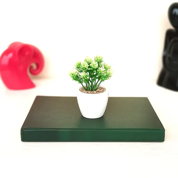 Elegant_Artificial_Green_Plant_Arrangement_in_a_White_Finish_Pot_with_Decorative_Pebbles