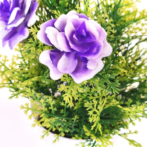 Exquisite_Artificial_Purple_Floral_Arrangement_with_Delicate_White_Accents_in_a_Sleek_White_Plastic_Pot