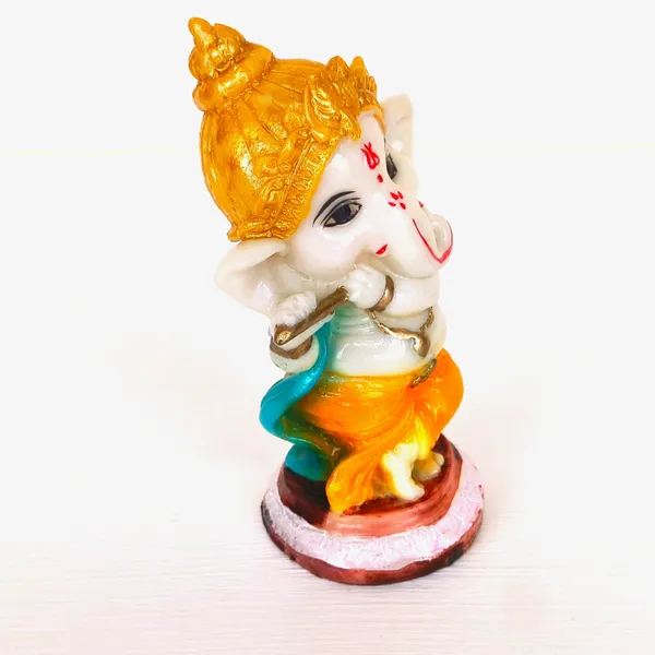 Vibrant_Hand-Painted__Lord_Ganesha_Statue_Playing_Flute_with_Golden_Crown,_Green_Shawl,_and_Orange_Dhoti