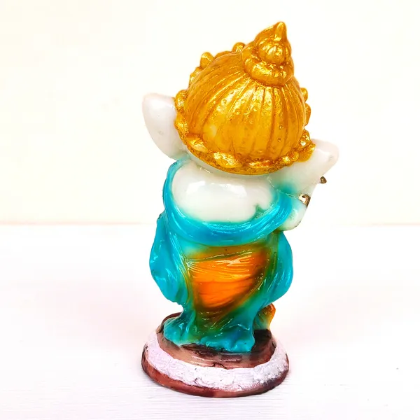 Vibrant_Hand-Painted__Lord_Ganesha_Statue_Playing_Flute_with_Golden_Crown,_Green_Shawl,_and_Orange_Dhoti