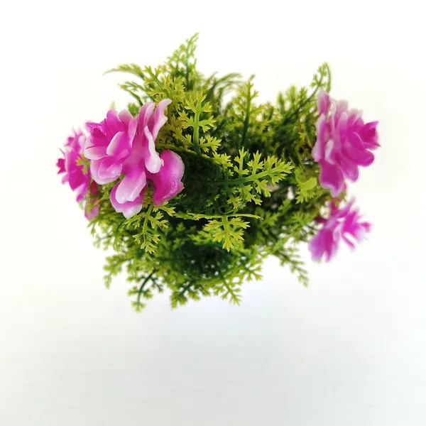 Exquisite_Artificial_Pink_Floral_Arrangement_with_Delicate_White_Accents_in_a_Sleek_White_Plastic_Pot