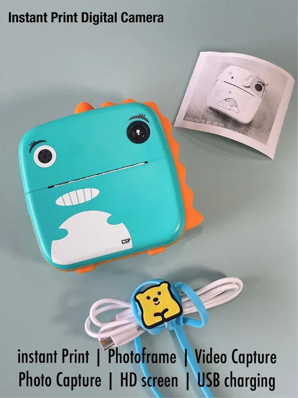 DINO_ORANGE_Kids_Print_Camera_Zero-Ink_Kids_Instant_Camera_Hd_Video_+_Print_&_Play_Selfie_Mode_With_Thermal_Paper_&_Silicone_Ring