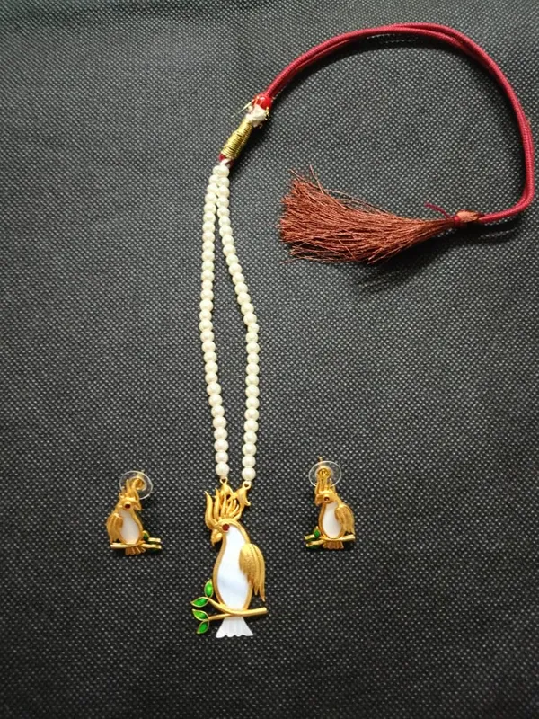 Purabi_Jewels_18k_Gold_Plated_Handcrafted_Cockatoo_Bird_On_Shell_Mother_Of_Pearl_Inlay_Pendant_With_White_Pearl_Necklace_And_Matching_Earrings_Set