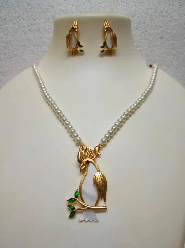 Purabi_Jewels_18k_Gold_Plated_Handcrafted_Cockatoo_Bird_On_Shell_Mother_Of_Pearl_Inlay_Pendant_With_White_Pearl_Necklace_And_Matching_Earrings_Set