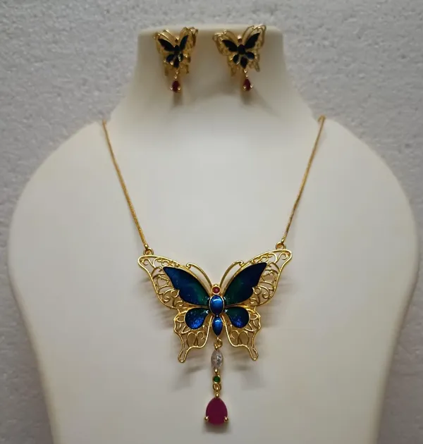 Purabi_Jewels_Valentine_Gift_Girlfriend_Wife_Gold_Plated_Crystal_Stone_Butterfly_Designer_Earrings_Chain_Pendant_Necklace_Combo_Jewellery_Set_For_Women_And_Girls_(Blue)
