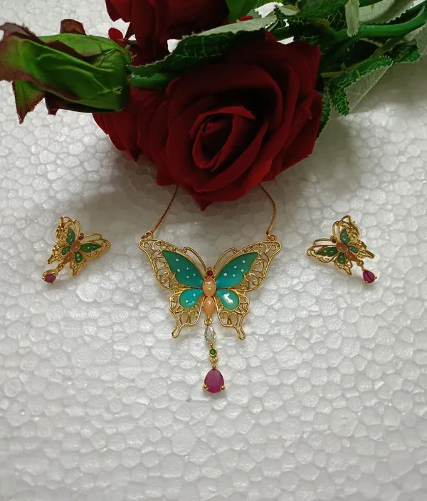 Purabi_Jewels_Valentine_Gift_Girlfriend_Wife_Gold_Plated_Crystal_Stone_Butterfly_Designer_Earrings_Chain_Pendant_Necklace_Combo_Jewellery_Set_For_Women_And_Girls_(Green)