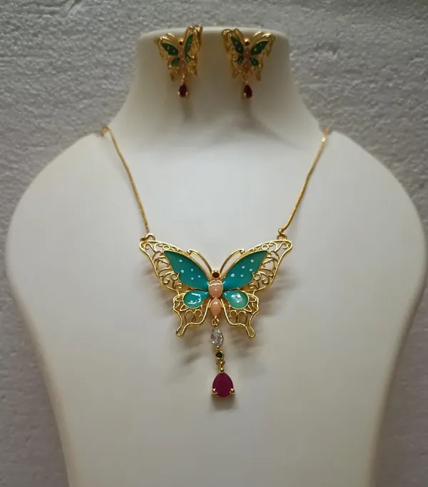 Purabi_Jewels_Valentine_Gift_Girlfriend_Wife_Gold_Plated_Crystal_Stone_Butterfly_Designer_Earrings_Chain_Pendant_Necklace_Combo_Jewellery_Set_For_Women_And_Girls_(Green)