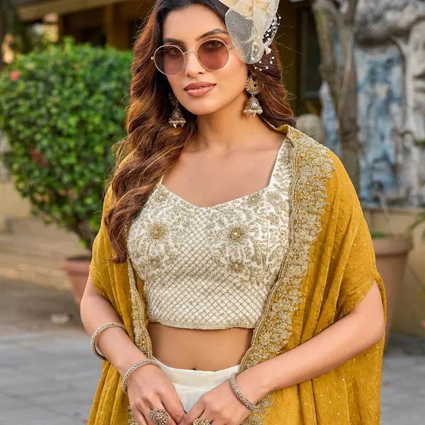 Yellow_Cream_And_White_Ethnic_Lehenga_Set_With_Embellished_Cape