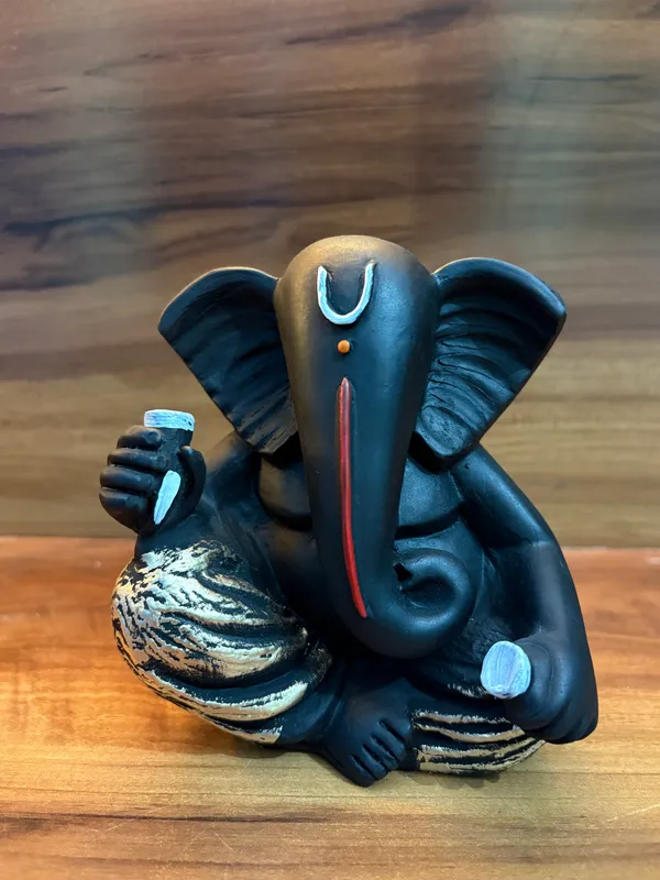 Set_of_4_Black_Ganesha_Idols_–_Decorative_Sitting_Ganesh_Figurines_for_Home_&_Office