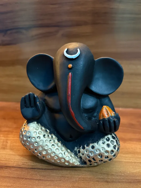 Set_of_4_Black_Ganesha_Idols_–_Decorative_Sitting_Ganesh_Figurines_for_Home_&_Office