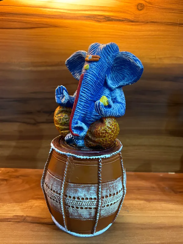 Handcrafted_Blue_Lord_Ganesha_Idol_Sitting_on_Traditional_Drum_12_inch_x_6_inch_–_Spiritual_Home_Décor_Showpiece