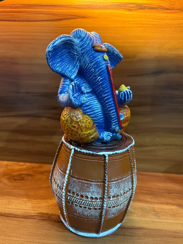 Handcrafted_Blue_Lord_Ganesha_Idol_Sitting_on_Traditional_Drum_12_inch_x_6_inch_–_Spiritual_Home_Décor_Showpiece