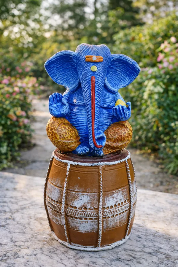 Handcrafted_Blue_Lord_Ganesha_Idol_Sitting_on_Traditional_Drum_12_inch_x_6_inch_–_Spiritual_Home_Décor_Showpiece