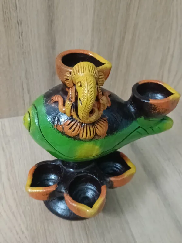 Handmade_yellow_terracotta_diya_�??_elegant,_eco-friendly_oil_lamp_for_Diwali,_puja,_weddings_&_home_décor