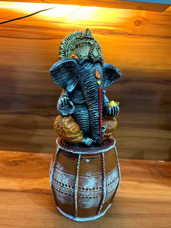 Handcrafted_Lord_Ganesha_Idol_Sitting_on_Dholak_12_inch_x_6_inch_–_Decorative_Resin_Statue_for_Home_&_Office