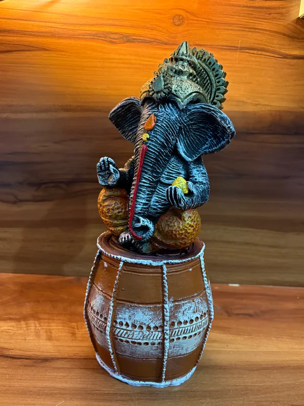 Handcrafted_Lord_Ganesha_Idol_Sitting_on_Dholak_12_inch_x_6_inch_–_Decorative_Resin_Statue_for_Home_&_Office