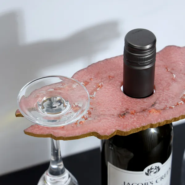 Pink_Resin_Wine_Bottle_Holder_In_Resin_For_Home_And_Dining_Table_Decor_(_(24X10)Cm_)