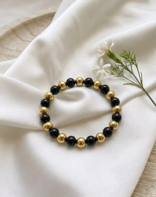 Golden_Hematite_and_Black_Beaded_Healing_Bracelet_-_Root_Chakra_Balance,_Grounding_Energy,_and_Protection_Stretch_Wristband_for_Men_and_Women