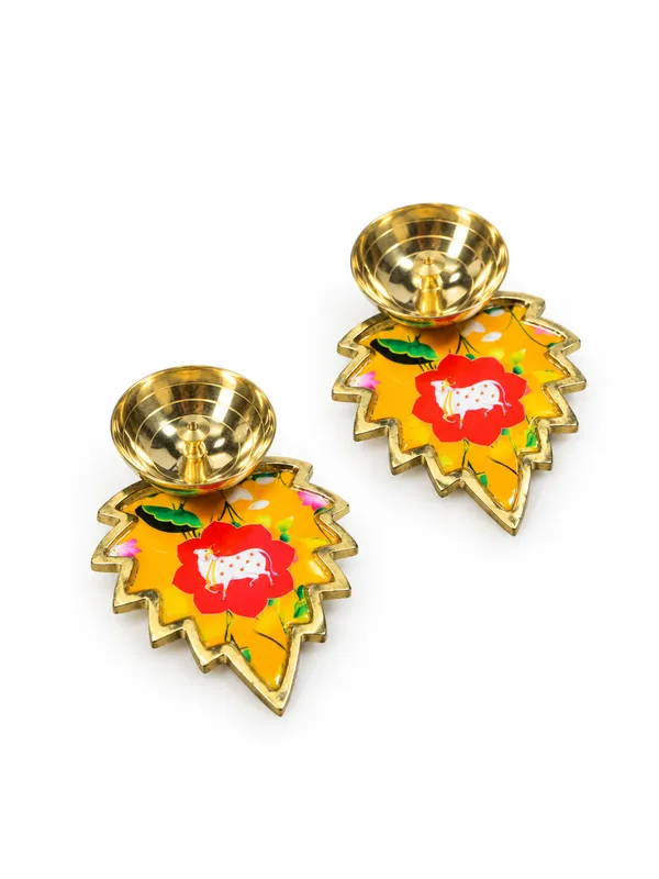 Pack_of_2_Decorative_Metal_Leaf_Shaped_Diyas_with_Golden_Finish_&_Colourful_Floral_Cow_Design_|_Traditional_Pooja_Oil_Lamps_for_Diwali,_Home_Temple,_Festive_Decoration,_Housewarming_&_Return_Gifts