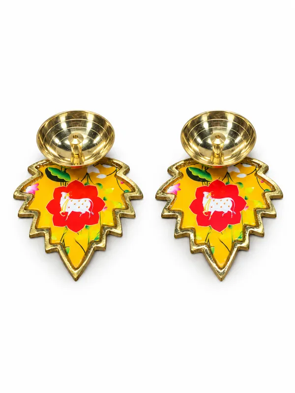 Pack_of_2_Decorative_Metal_Leaf_Shaped_Diyas_with_Golden_Finish_&_Colourful_Floral_Cow_Design_|_Traditional_Pooja_Oil_Lamps_for_Diwali,_Home_Temple,_Festive_Decoration,_Housewarming_&_Return_Gifts