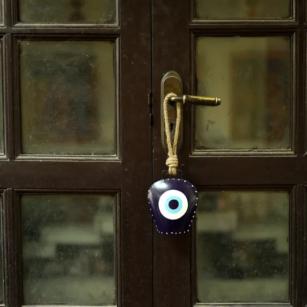 Metal_Wall_Hanging_Swiss_EvilEye_CowBell_Hanging_with_the_Floral_Design