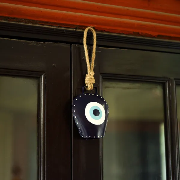 Metal_Wall_Hanging_Swiss_EvilEye_CowBell_Hanging_with_the_Floral_Design