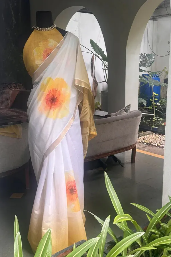 WHITE_&_ORANGE_FLOWER_LINEN_SAREES