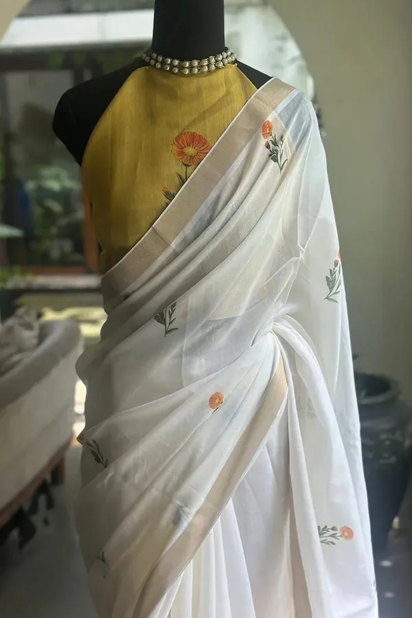 WHITE_&_ORANGE_FLOWER_LINEN_SAREES