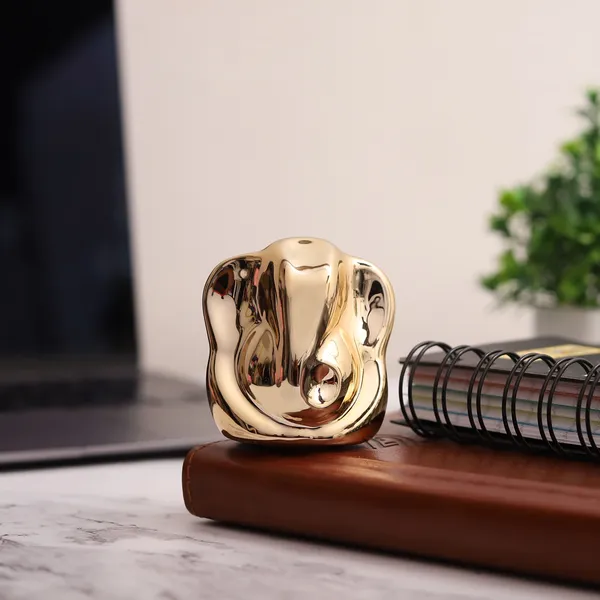 Golden_Ceremic_Ganesh_Idol_For_Car_Dashboard_|_Home_Decor_|_Gifting_&_Prosperity__-__6_Cm