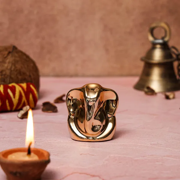 Golden_Ceremic_Ganesh_Idol_For_Car_Dashboard_|_Home_Decor_|_Gifting_&_Prosperity__-__6_Cm