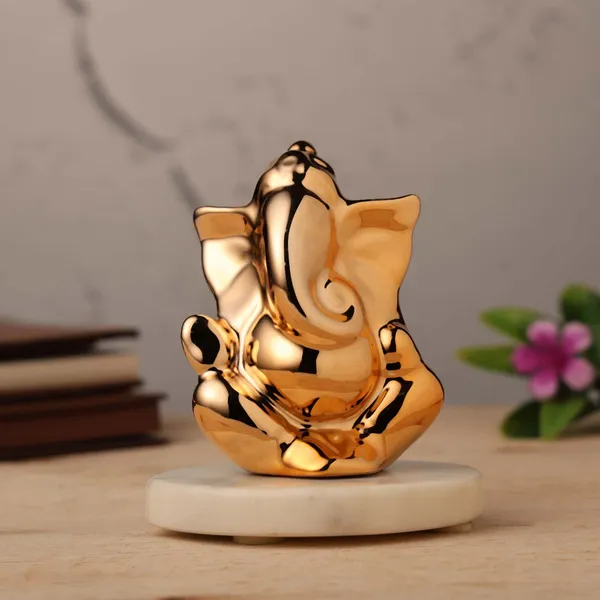 Ganesh_Idol_for_Home_Decor_&_Car_Dashboard_|_Ganesh_Ji_Murti_Decorative_Showpiece_for_Home_Decor_|_Pooja_Room_&_Office_Desk_(Golden)_10_CM