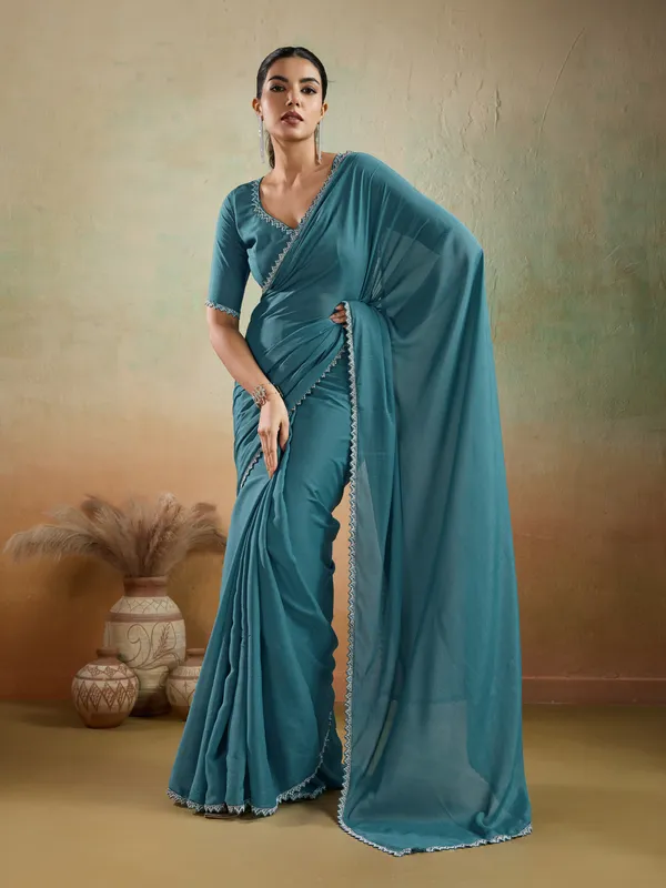 Teal_Blue_Matt_Georgette_Saree_With_Ceramic-Inspired_Embellished_Lace_For_Women