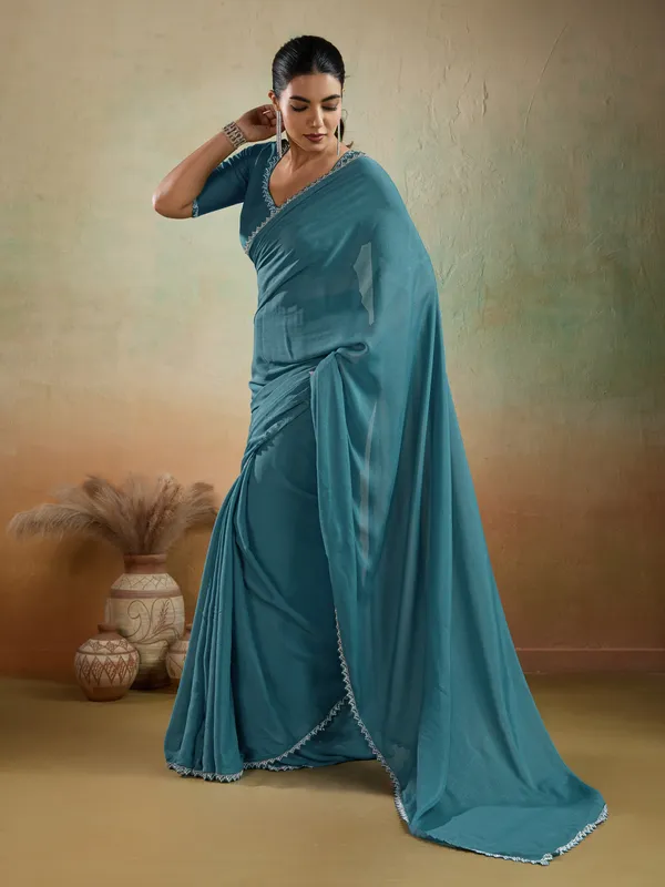 Teal_Blue_Matt_Georgette_Saree_With_Ceramic-Inspired_Embellished_Lace_For_Women