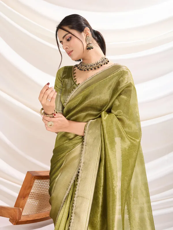 Olive_Green_Linen_Tissue_Saree_with_subtle_Zari_Border