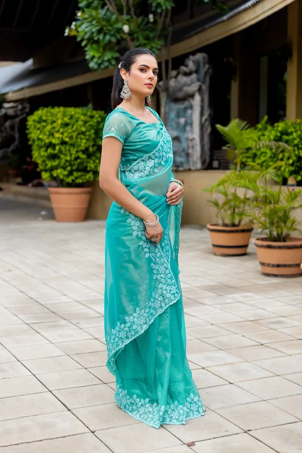 Elegant_Sea_Green_Twill_infused_Organza_Saree_with_White_Floral_Embroidery