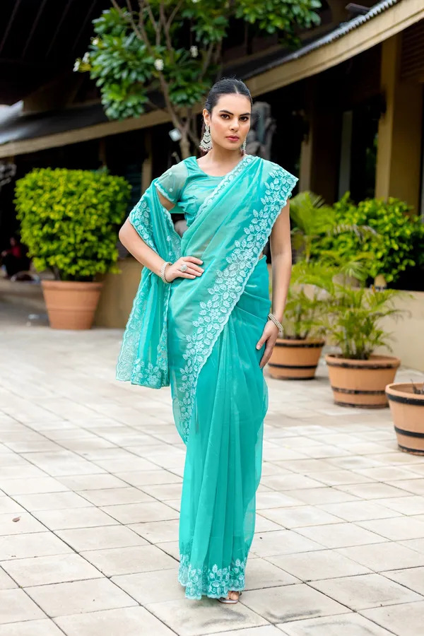 Elegant_Sea_Green_Twill_infused_Organza_Saree_with_White_Floral_Embroidery