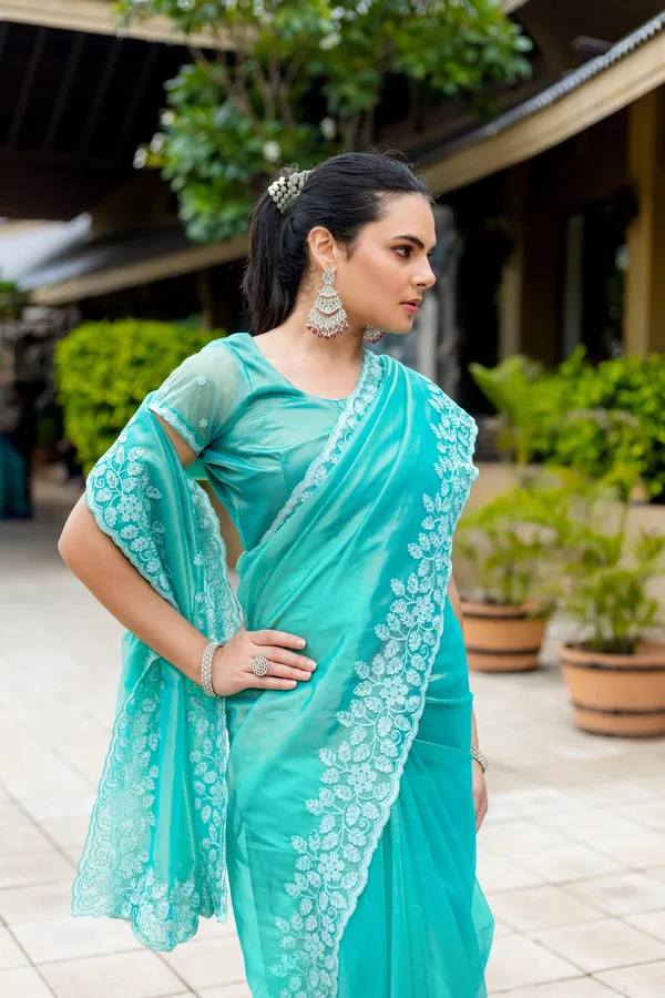 Elegant_Sea_Green_Twill_infused_Organza_Saree_with_White_Floral_Embroidery