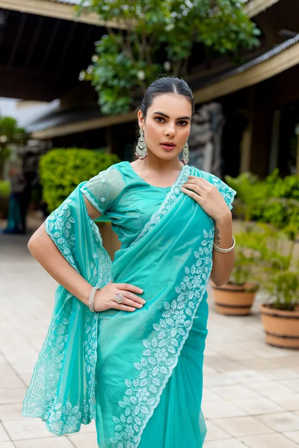 Elegant_Sea_Green_Twill_infused_Organza_Saree_with_White_Floral_Embroidery