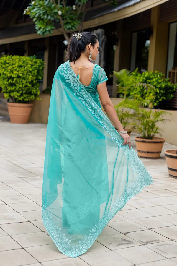 Elegant_Sea_Green_Twill_infused_Organza_Saree_with_White_Floral_Embroidery