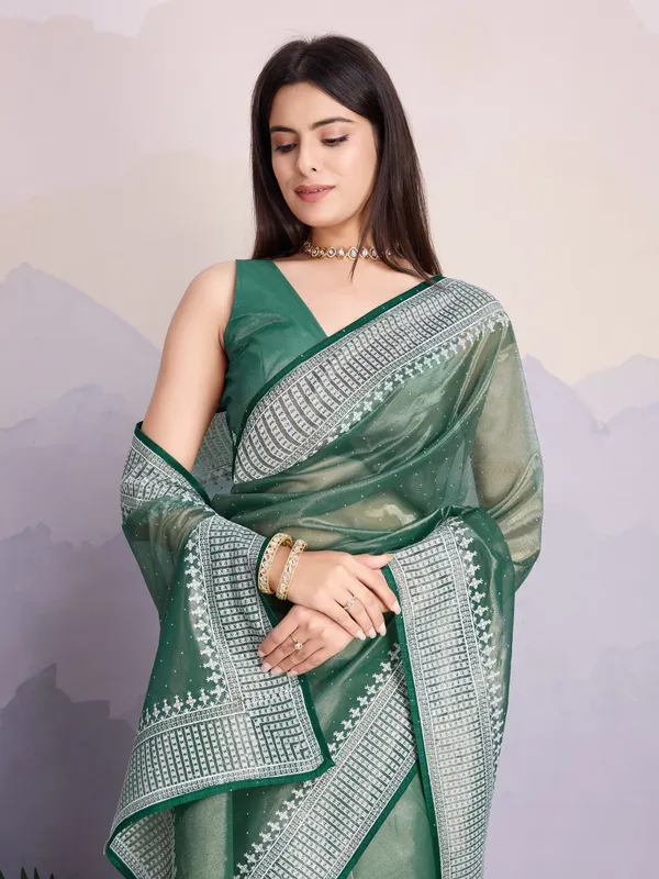 Teal_Green_Maharani_Style_Infused_Twill_Net_In_Shiny_Saree