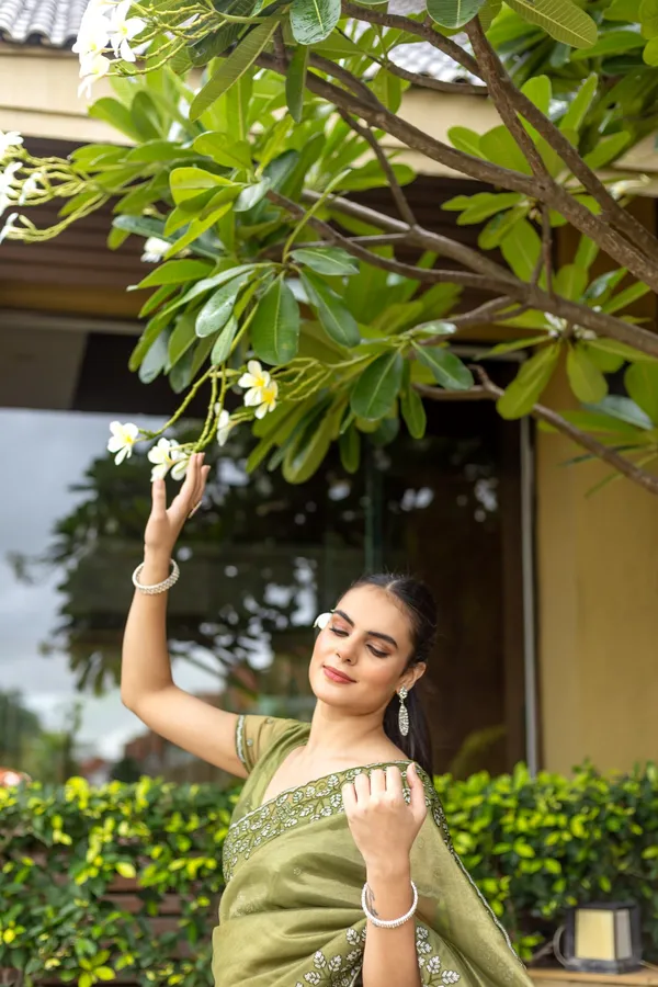 Elegant_Sage_Green_Twill_infused_Organza_Saree_with_Silver_Floral_Embroidery