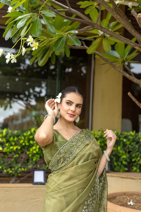 Elegant_Sage_Green_Twill_infused_Organza_Saree_with_Silver_Floral_Embroidery