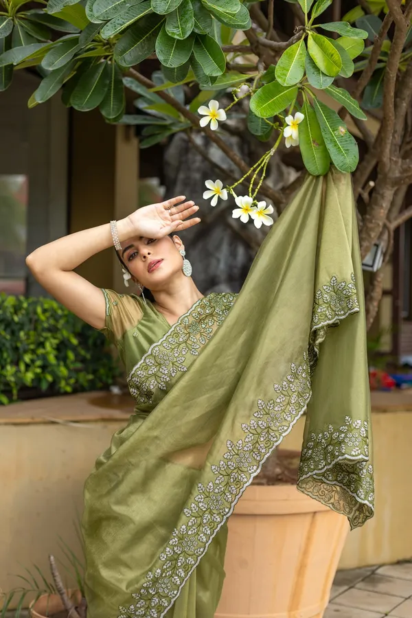 Elegant_Sage_Green_Twill_infused_Organza_Saree_with_Silver_Floral_Embroidery