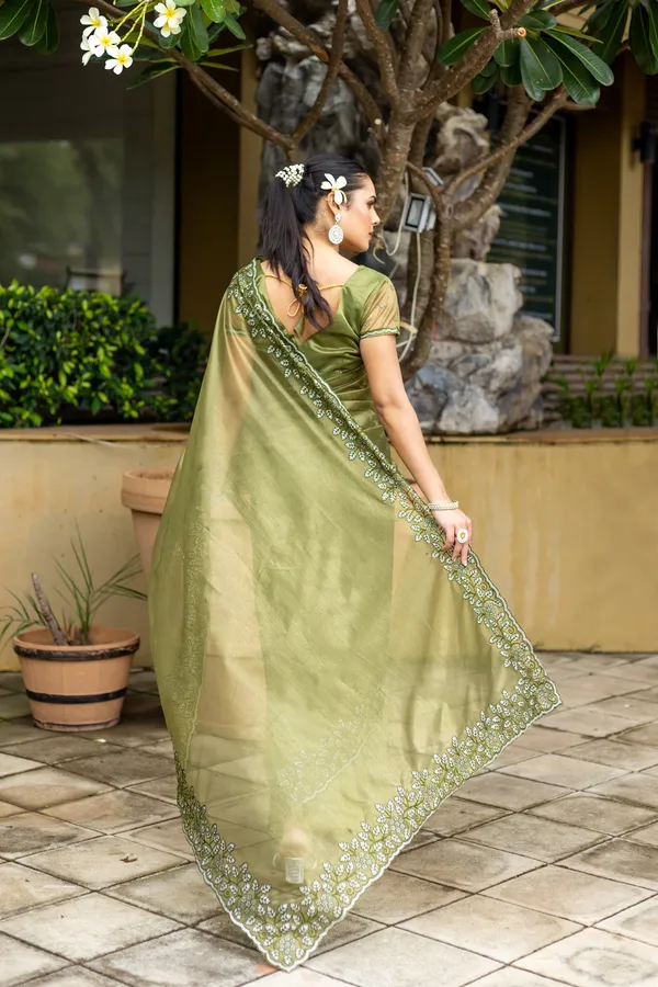 Elegant_Sage_Green_Twill_infused_Organza_Saree_with_Silver_Floral_Embroidery