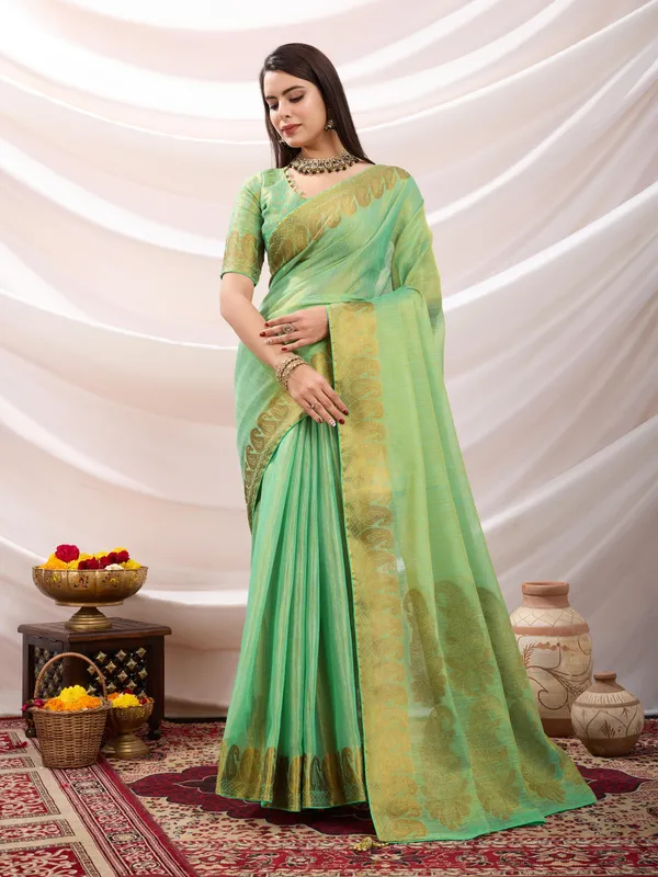 Pastel_Green_Linen_Tissue_With_Golden_Zari_Weaving_Designer_Blouse_&_Tassels_Saree