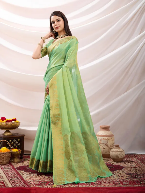 Pastel_Green_Linen_Tissue_With_Golden_Zari_Weaving_Designer_Blouse_&_Tassels_Saree