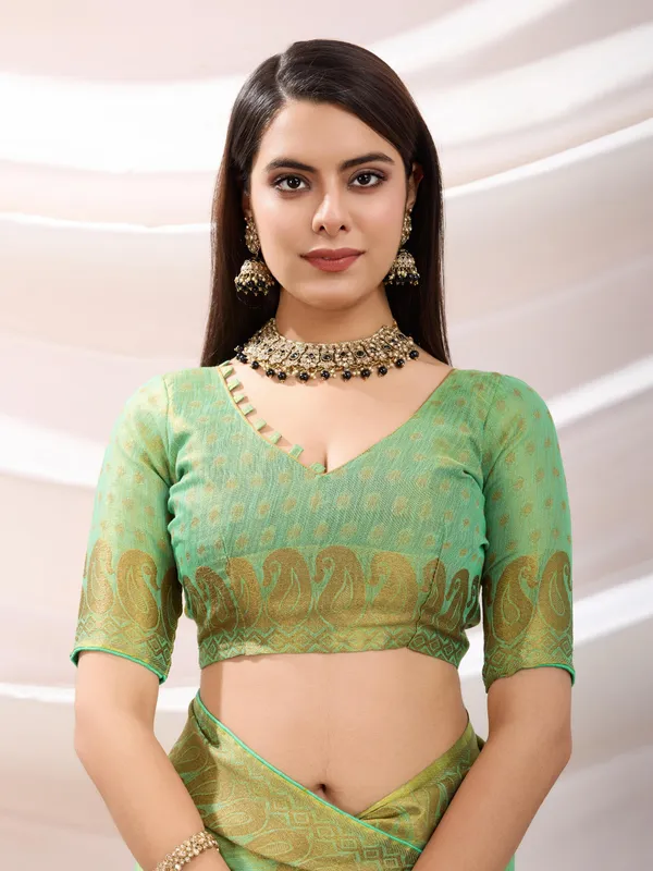 Pastel_Green_Linen_Tissue_With_Golden_Zari_Weaving_Designer_Blouse_&_Tassels_Saree