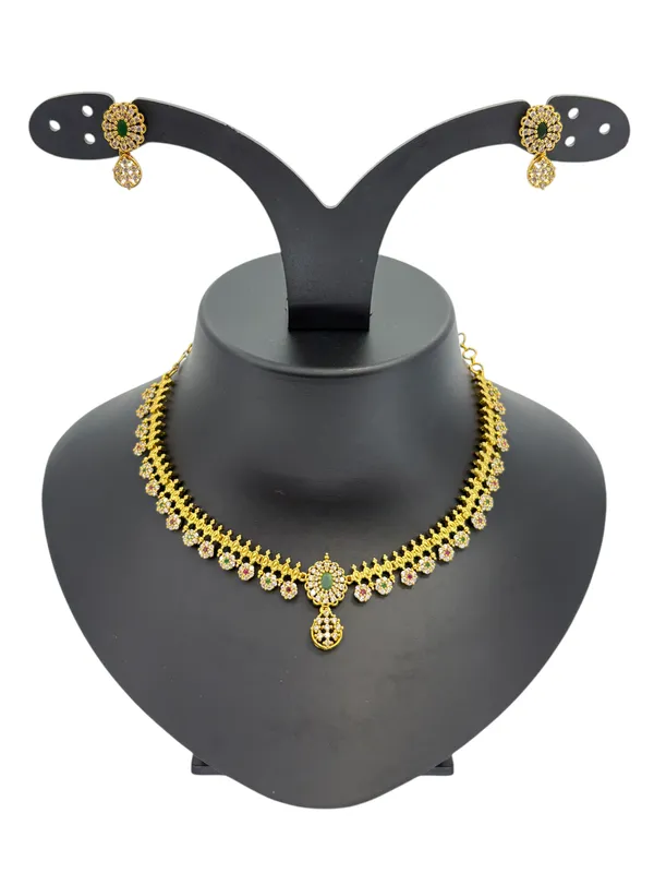 Floral_AD_Necklace_Set_in_Matte_Gold_Finish_with_Green_&_White_Stone_Detailing